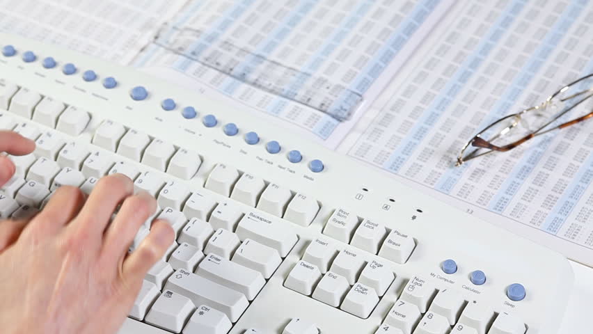 Business woman typing on a computer keyboard. Accounting 