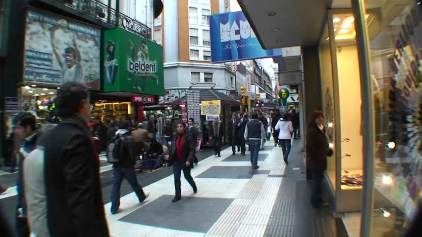 BUENOS AIRES, ARGENTINA - CIRCA 2009: People walk shop and window shop on a busy street circa 2009 in Buenos Aires, Argentina.