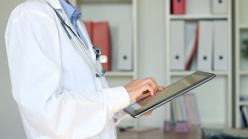 Doctor hands with tablet computer in the office