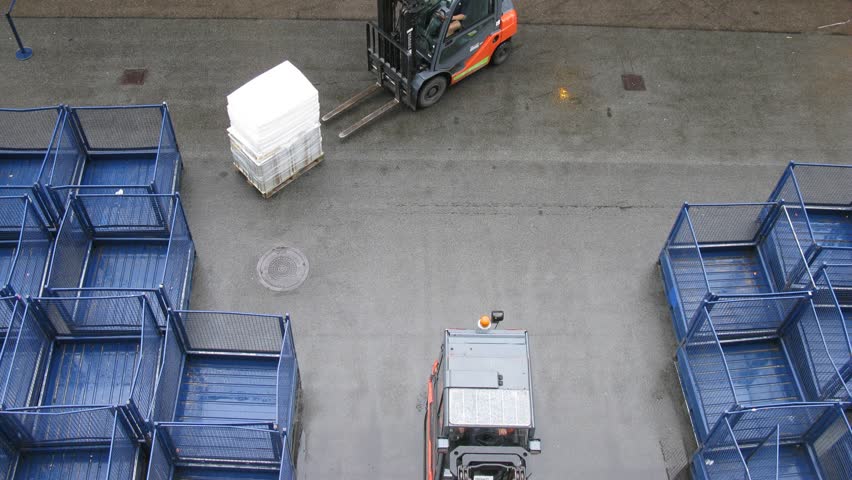COPENHAGEN, DENMARK - JULY 12: (Timelapse View) Baggage loaders work in port on July 12, 2011 in Copenhagen, Denmark. The Port of Copenhagen is the largest Danish seaport and one of the largest ports in the Baltic Sea basin