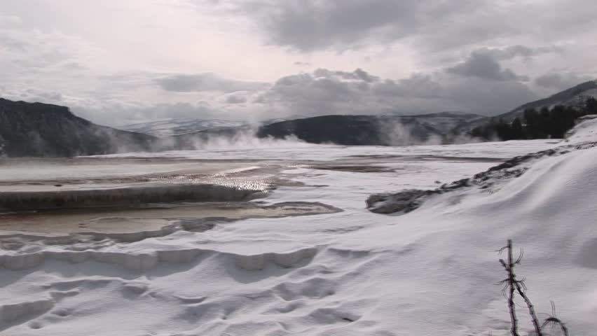 Panoramic view of steamy hot springs in winter