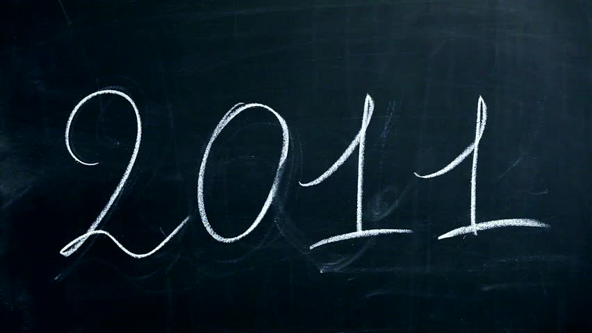Hand transforming the number 2011 into a new 2012 for new year concept