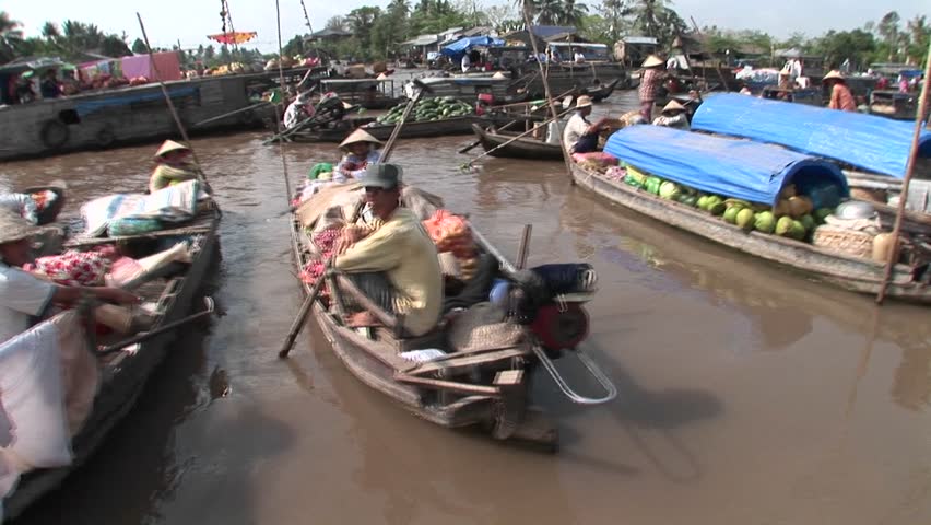 VIETNAM - CIRCA 2009: A market floats along river circa 2009 in Vietnam.