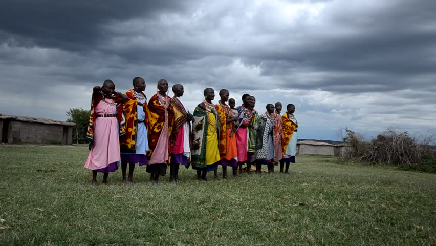 MASAI MARA, KENYA, AFRICA - OCTOBER 17: Masai women  singing as part of a traditional cultural ceremony near Masai Mara National Park Reserve, Kenya on October 17, 2011