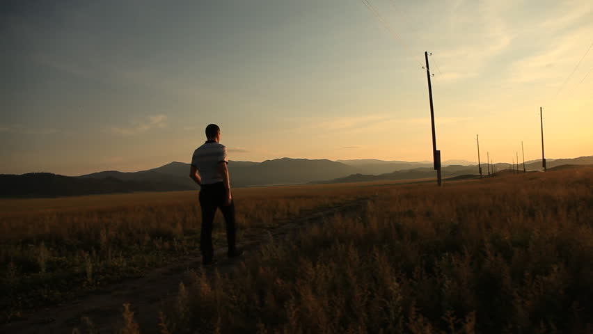 Man walks along the transmission line