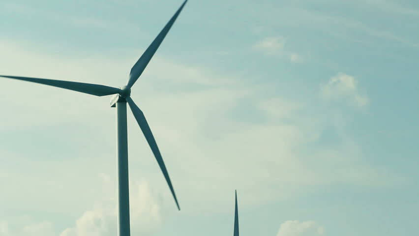 Wind turbine at blue sky