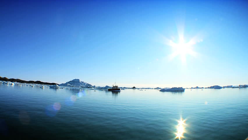 Nautical Vessel Sailing Past Icebergs