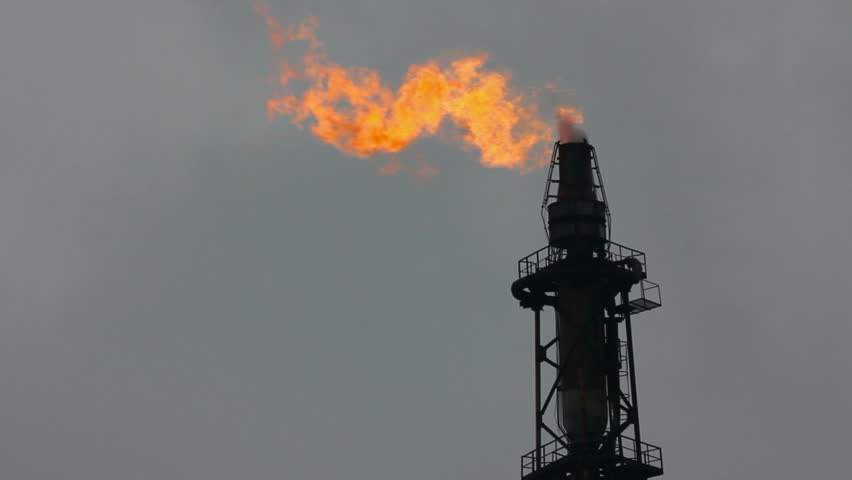 torch is lit on tower refinery - air pollution