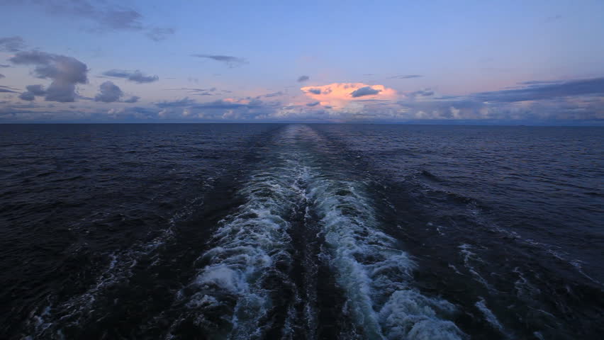 Evening sky and a trace of the ship in the ocean