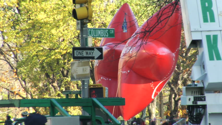 NEW YORK - NOVEMBER 24: Macy's iconic star balloons pass Columbus Circle at the Macy's Thanksgiving Day parade, November 24, 2011 in New York 