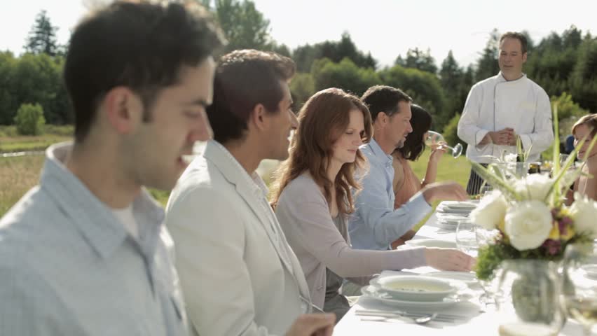 People at dinner party on a farm