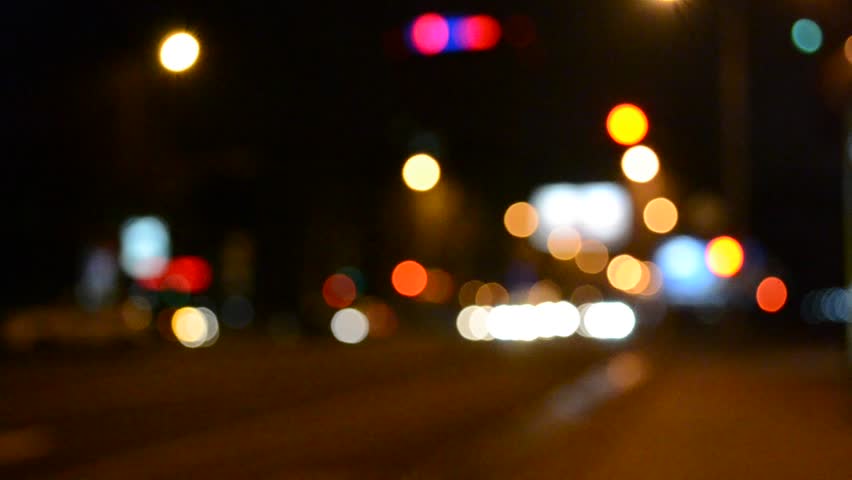 Out of focus lights of a street at night