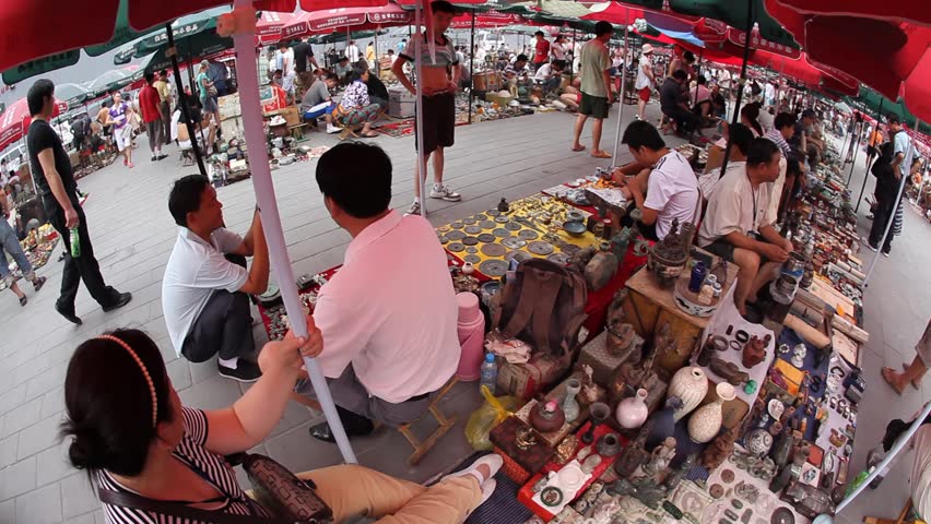 BEIJING, CHINA - JULY 5, 2009: Vendors display crafts at a flea market on July 5, 2009 in Beijing.