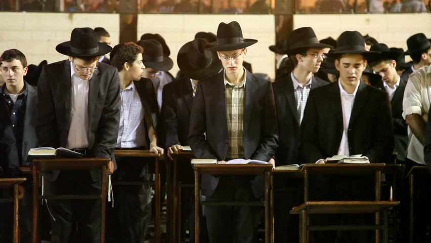 JERUSALEM, ISRAEL - OCT 6, 2011: Yeshiva students pray during Slihot at the Western Wall on October 6, 2011 in Jerusalem.