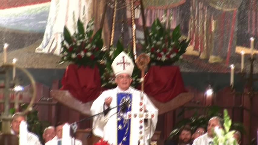NAZARETH, ISRAEL - DEC 24, 2008: Priest gives French salutation at the Basilica of Annunciation on December 24, 2008 in Nazareth.