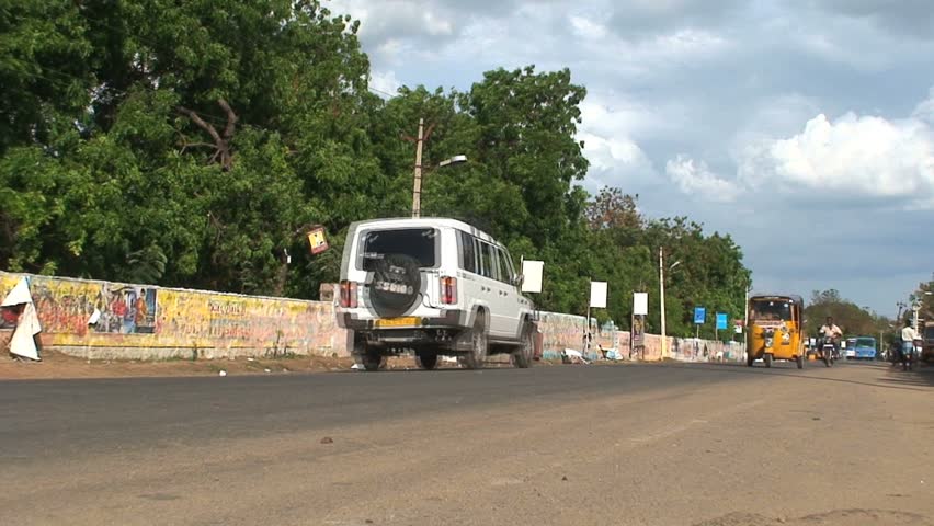 MADURAI, INDIA - CIRCA APRIL 2011: Traffic rushes by circa April 2011 in downtown Madurai.