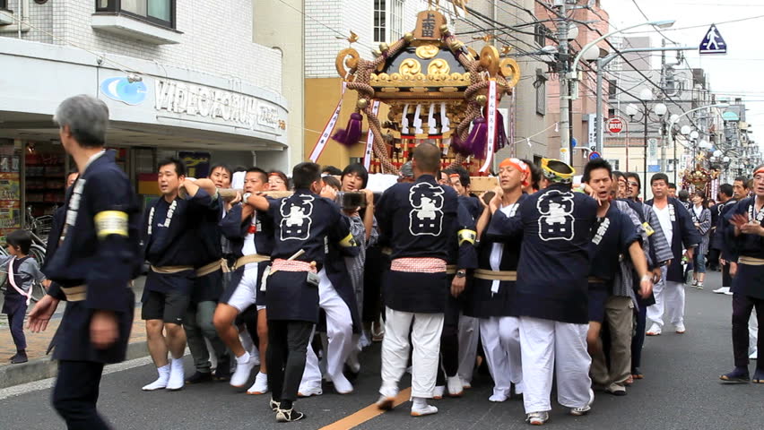 CHOFU-SEPTEMBER 23: Annual autumn festival. Parade o-mikoshi (portable shrines)  in Chofu, Tokyo, September 23, 2011.