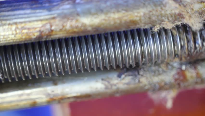 Macro Of Oily And Greasy Screw Threads Turning