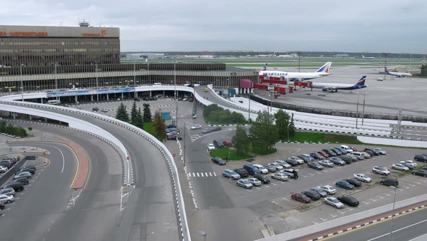 MOSCOW - SEPTEMBER 22: (Timelapse View) Cars leave and come to building of airport of  Sheremetyevo, on September 22, 2011 in Moscow, Russia
