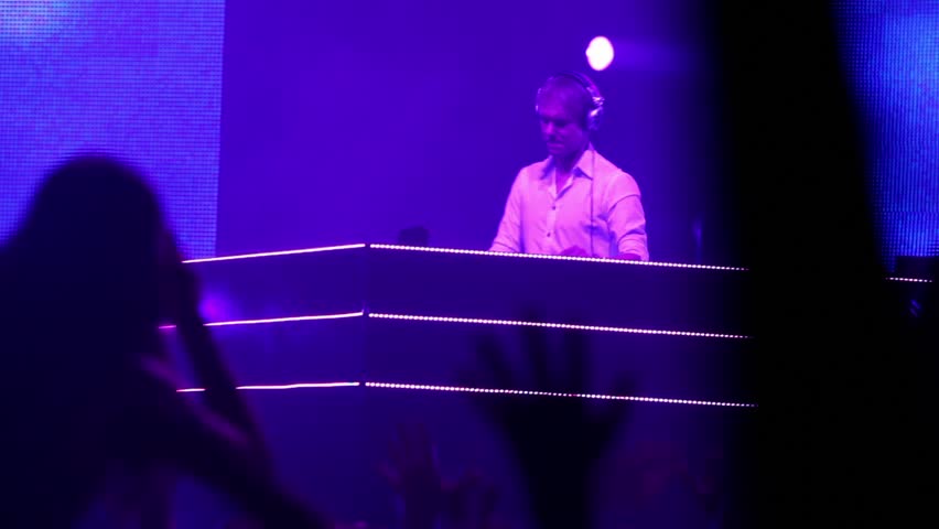 MOSCOW - MAY 6: Popular Dutch DJ Armin Van Buuren on stage, many people at rave party, hand and heads, on May 6, 2011 in Moscow, Russia.