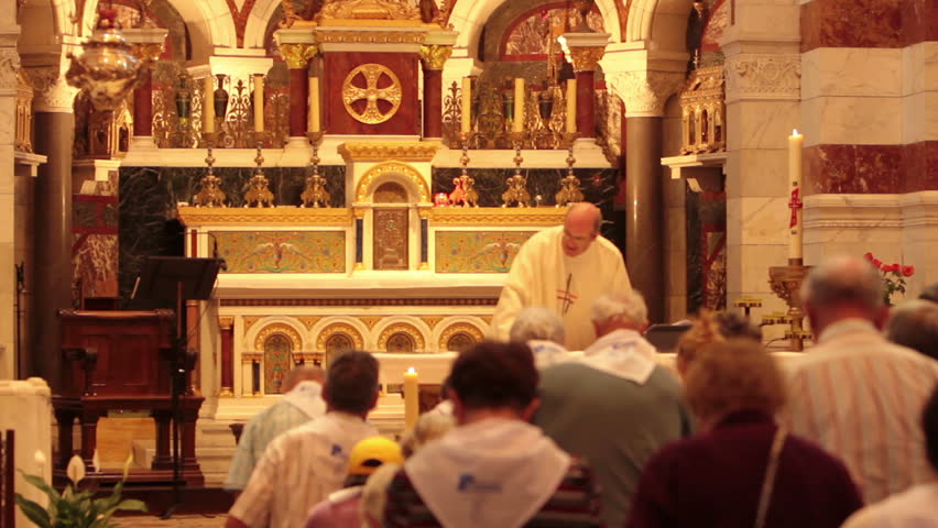 MARSEILLE, FRANCE - CIRCA MAY 2011: Catholic religious sacrament ceremony is held in historic and beautiful Basilica Notre Dame de la Garde in Marseille France circa May 2011. Devout Christians stand by religion.