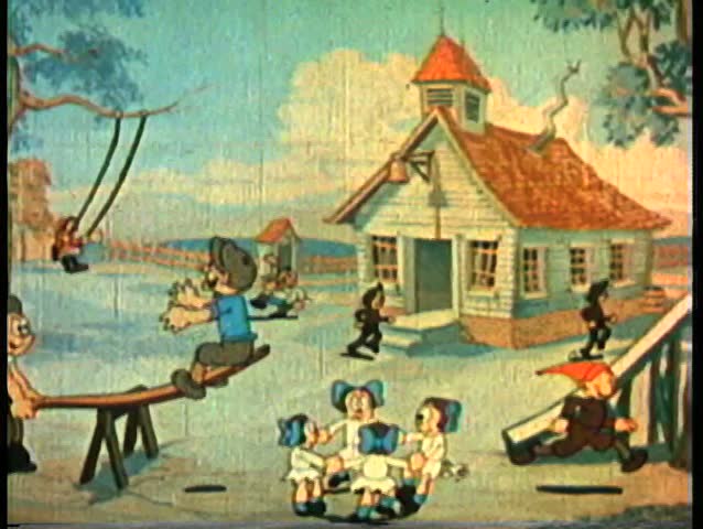 Wide shot children playing in front of schoolhouse