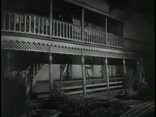 Wide shot two men falling off balcony