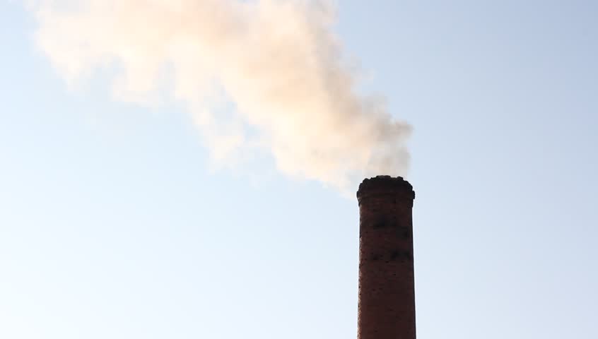 Pollution, smoke and steam from the chimney of an industrial enterprise. HD H.264