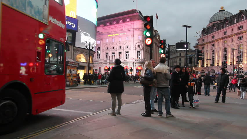 LONDON, UK - DECEMBER 27: Tourists, busses and other traffic on Piccadilly Circus on December 27, 2012 in London, UK. Piccadilly Circus is one of the main entertainment areas of London