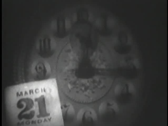 Passage of time indicated on clock and calendar