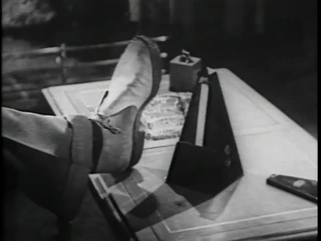Close-up of shoe imitating movements of  metronome