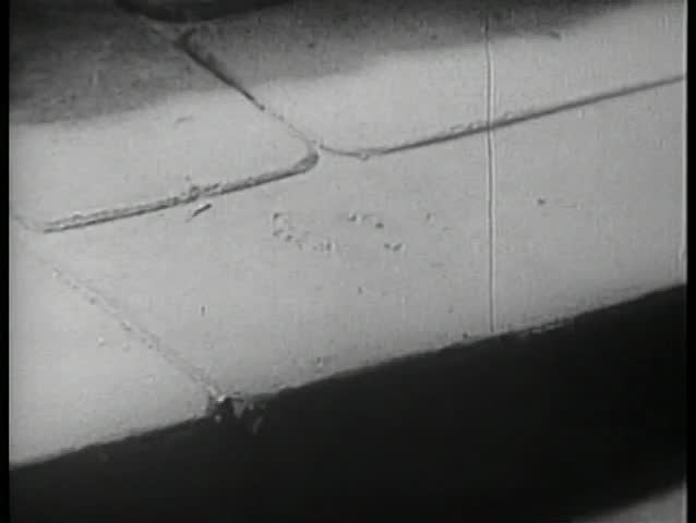 Gun falling on sidewalk