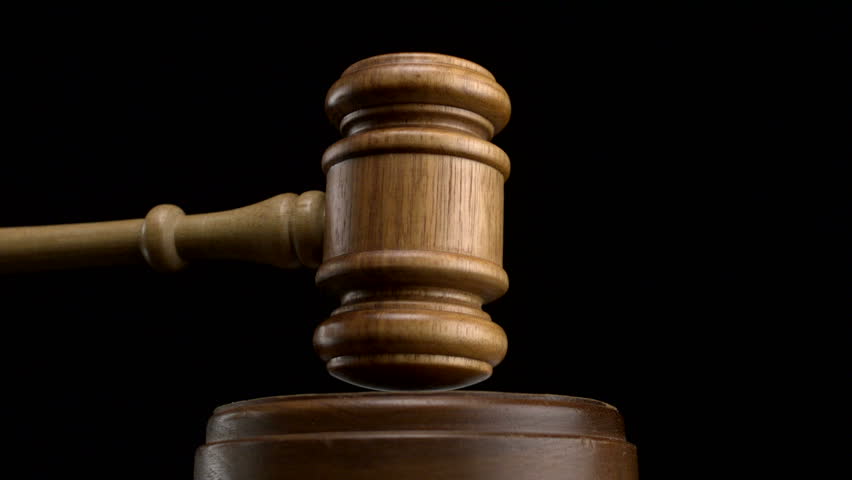 Gavel pounded on block