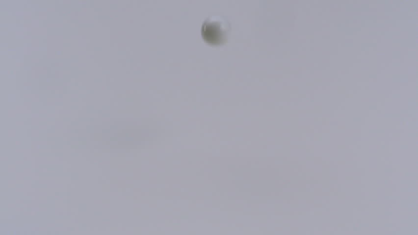 Slo-motion milk dropping