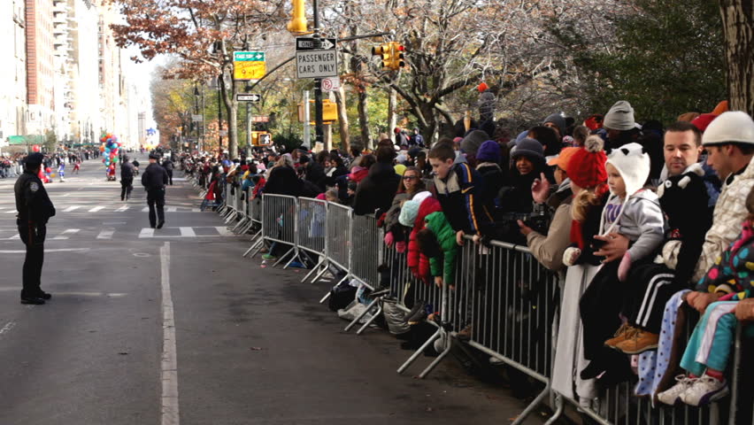 NEW YORK CITY, NY - NOVEMBER 24: Macy's parade crowds along fence during Macy's Thanksgiving Day Parade on November 24, 2011 in New York City, New York. 