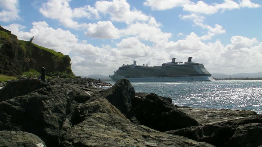 SAN JUAN, PUERTO RICO - CIRCA JAN 2012: Big cruiseship close to rocky shore circa January 2012 in San Juan, Puerto Rico.