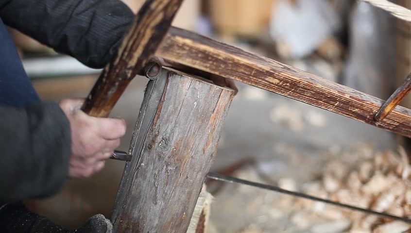 Saw cutting through wood