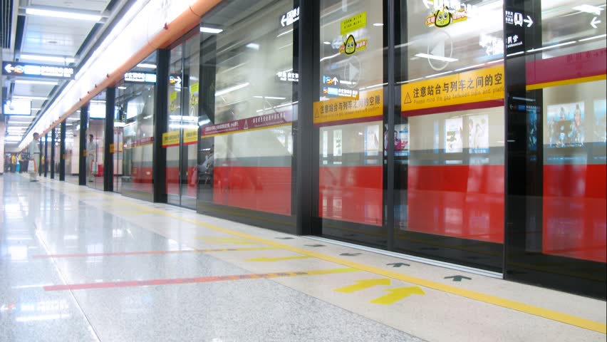 GUANGZHOU - NOV 23: (Timelapse View) Glass door is closed before train in subway, on Nov 23, 2011 in Guangzhou, Guangdong, China