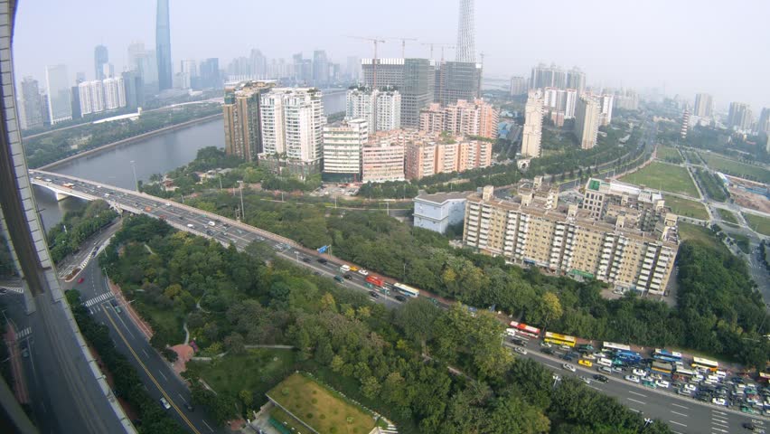 Cars go to bridge through Pearl river in afternoon, time lapse