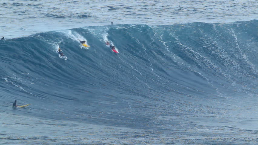MAUI, HI - January 31: Professional surfers ride a giant wave at the legendary big wave surf break known as "Jaws" during one the largest swells of the winter January 31, 2012 in Maui, HI.