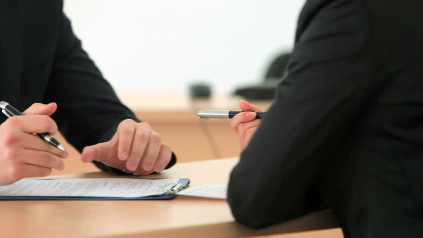 Someone undergoing a job interview or a answering the questions of the poll by filling the form