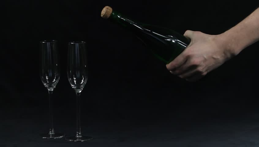 Opening a bottle of champagne with a knife (sword)