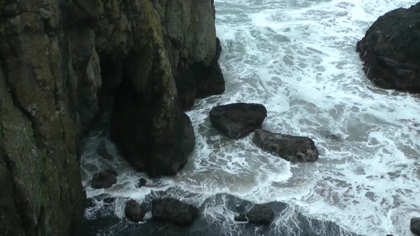 Ocean swells surging through caves