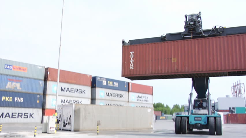 NOVOSIBIRSK, RUSSIA - MAY 20: The Crane moves containers on a logistical warehouse in the open air on May 20, 2010 in Novosibirsk, Russia.