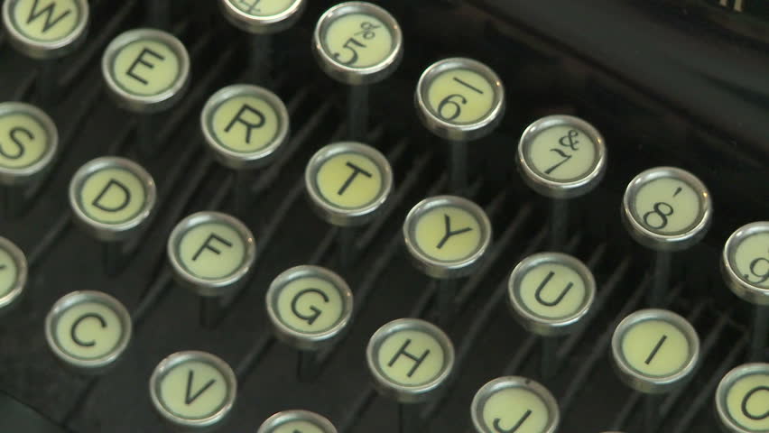Woman typing on antique typewriter