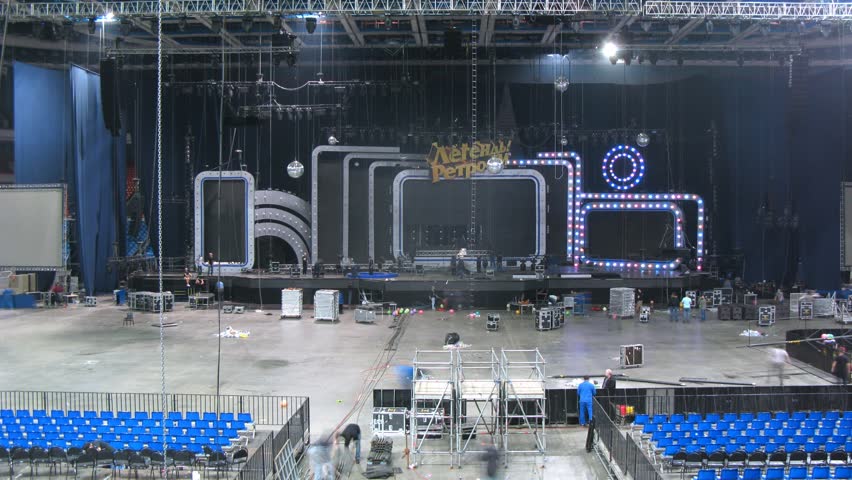 MOSCOW - DEC 17: (Timelapse View) Sceneshifters mount equipment for concert of Legend RetroFM in Sports complex Olimpiyskiy, on Dec 17, 2011 in Moscow, Russia
