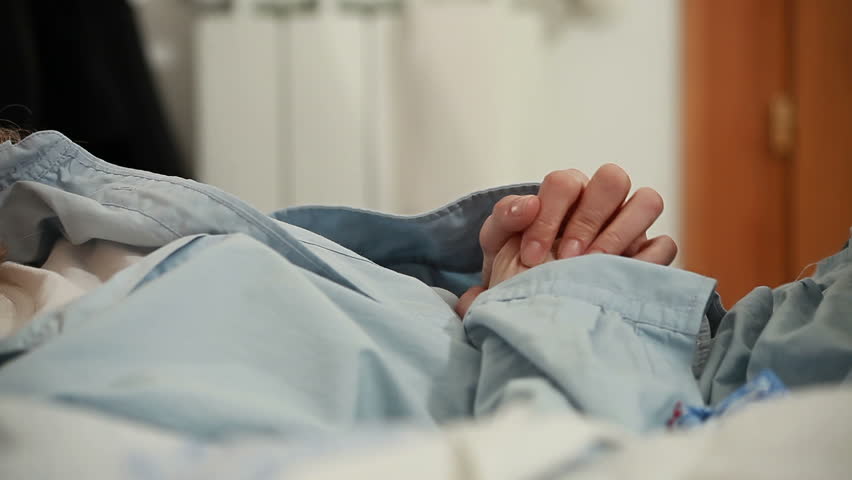 Sick woman in bed