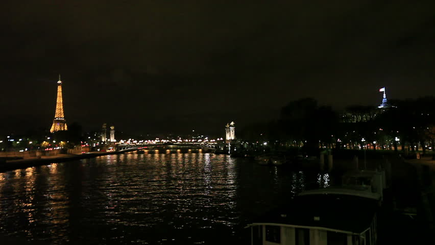 Eiffel Tower and bridge in Paris night lights