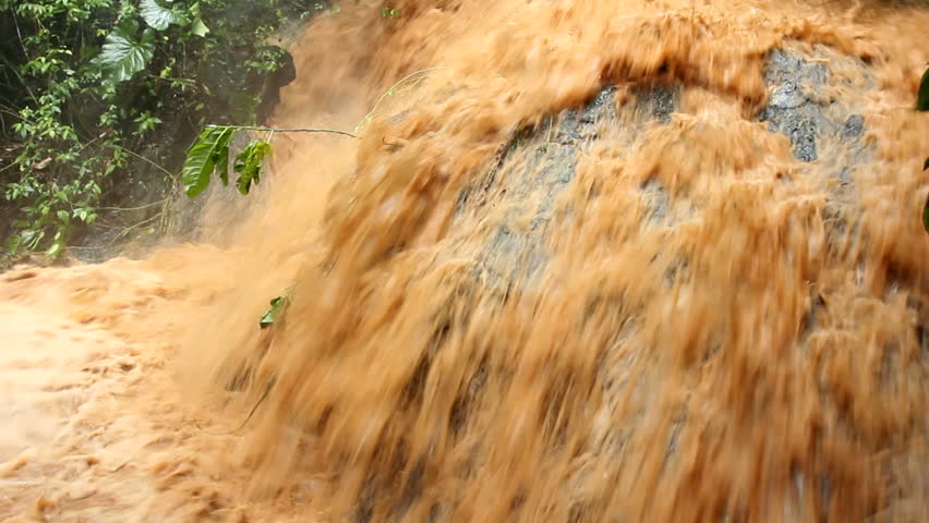 Mud and water pouring down a jungle watercourse after very heavy rain. On the Pacific coast of Ecuador.