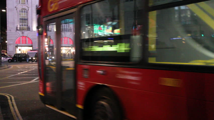 LONDON, UK - DECEMBER 27: Busses and other traffic drive by on Piccadilly Circus on December 27, 2011 in London, UK. Piccadilly Circus is one of the main entertainment areas of London.